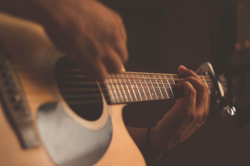 guitarist strumming