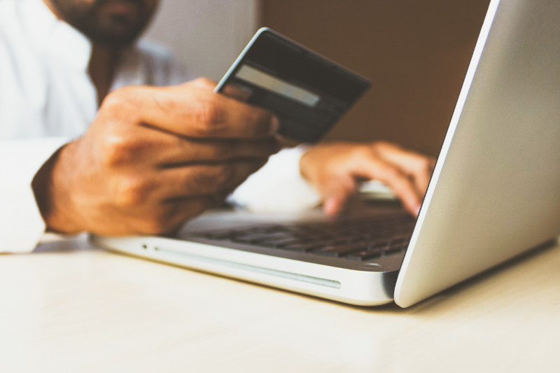 person on laptop with credit card 800x500 person on laptop with credit card